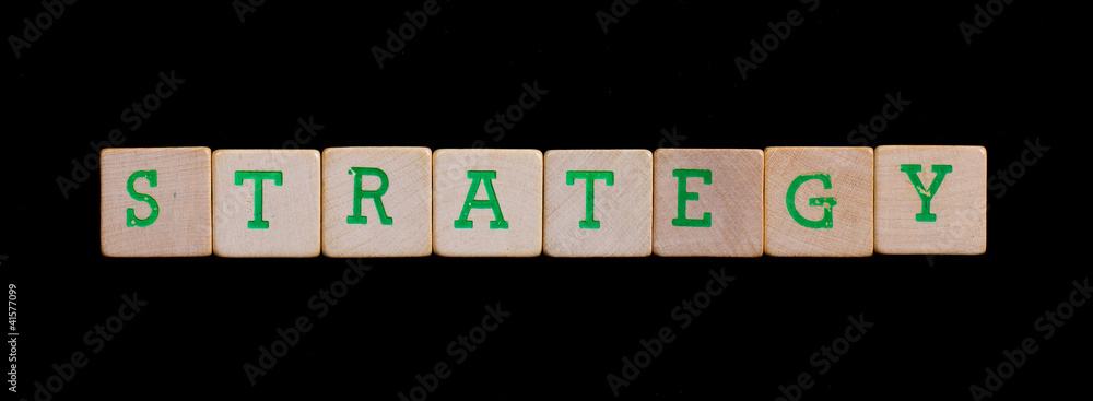 Green letters on old wooden blocks (strategy)