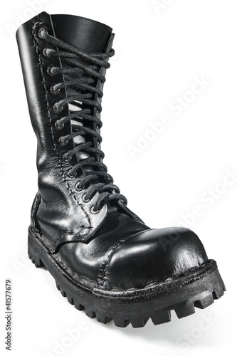 Close-up on the black, shiny, hand made army boot.