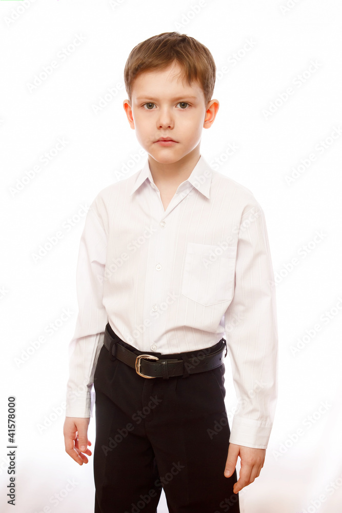 serious businessman, boy 7 years with strong blond look in trous serious businessman, boy 7 years with strong blond look in trous
