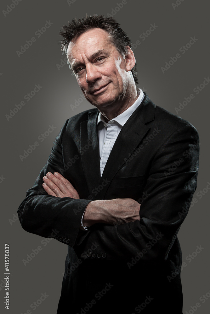 Handsome Smiling Middle Age Business Man Arms Folded Grey