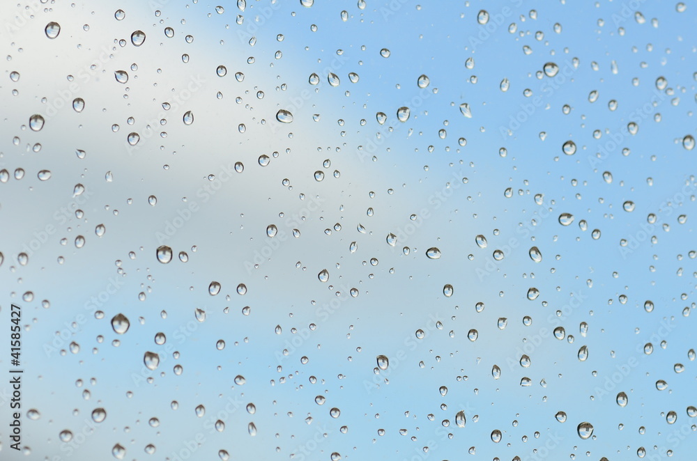Drops of rain on a window pane as a background Drops of rain on a window pane as a background