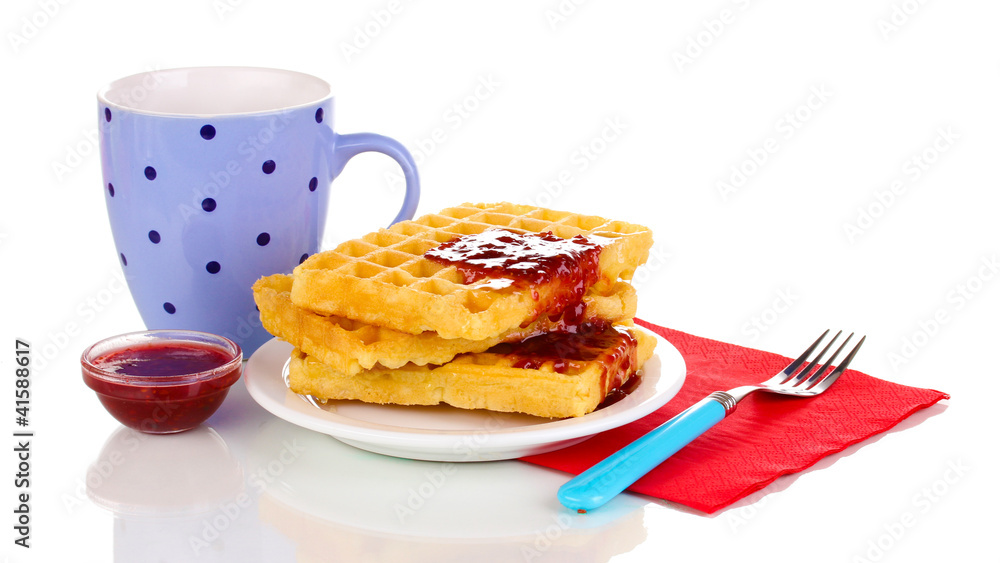 Tasty waffles with jam on plate isolated on white Tasty waffles with jam on plate isolated on white