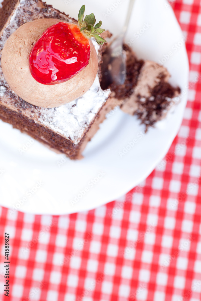 beautiful cake with strawberry on plaid fabric beautiful cake with strawberry on plaid fabric