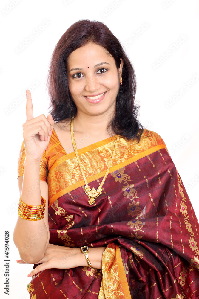Traditional Indian woman holding her index finger up