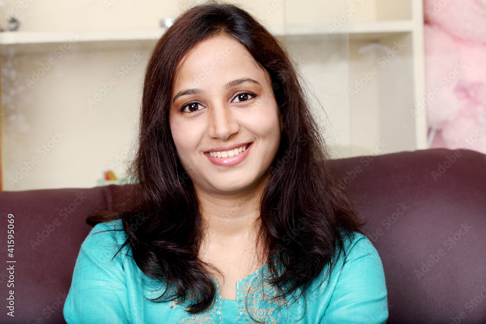 Portrait of smiling young Indian woman Portrait of smiling young Indian woman