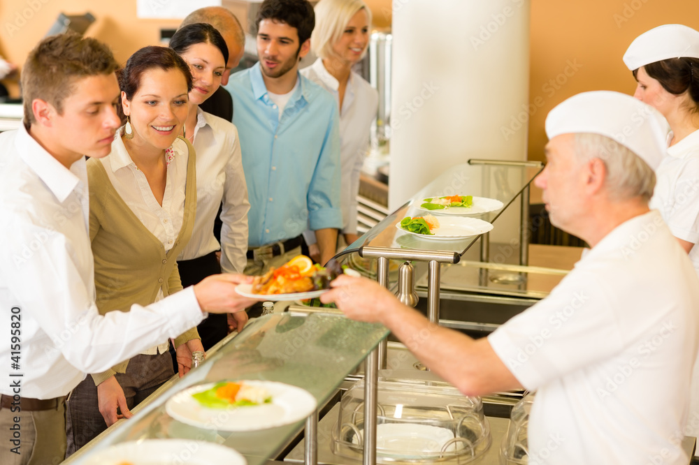 Office colleagues in canteen cook serve meals Office colleagues in canteen cook serve meals