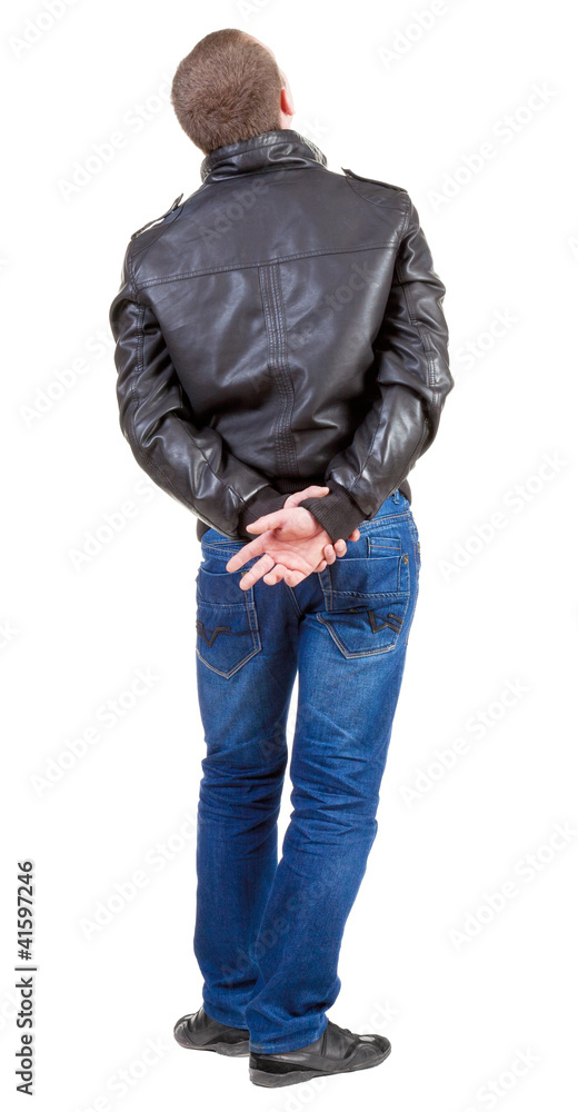 Back view of handsome man in jacket looking up. Back view of handsome man in jacket looking up.