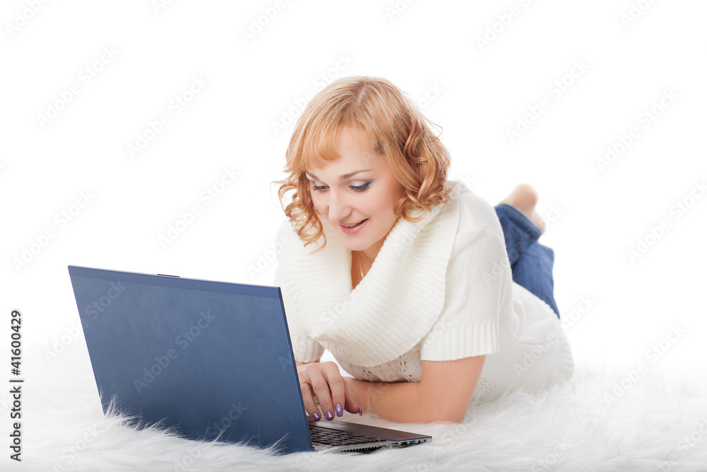 Naklejka premium Young woman with a laptop.