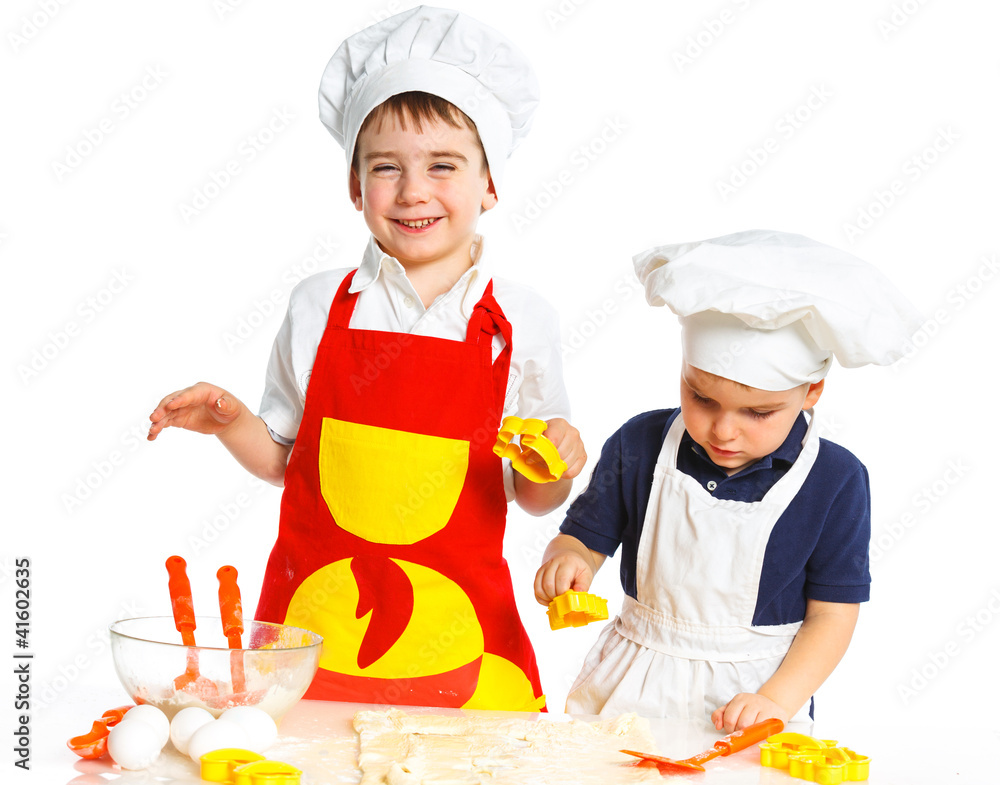 Two beautiful caucasian brothers making a cake Two beautiful caucasian brothers making a cake