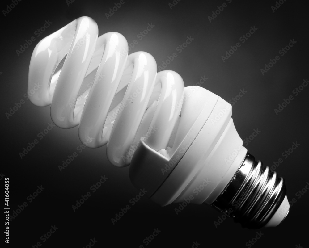 Energy saving lamp on black background Energy saving lamp on black background