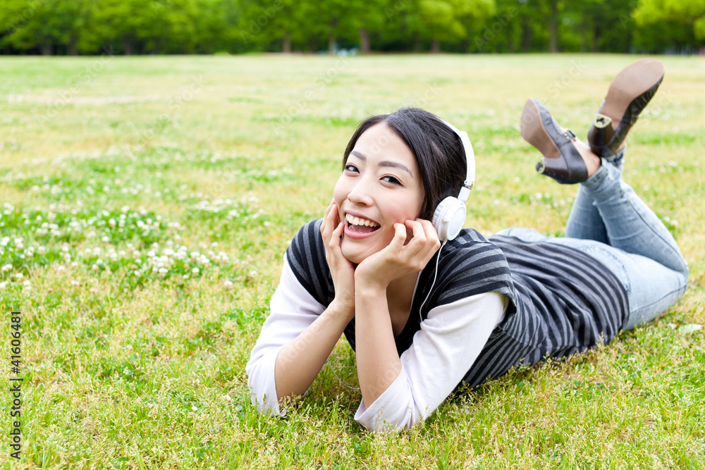 attractive asian woman relaxing in the park attractive asian woman relaxing in the park