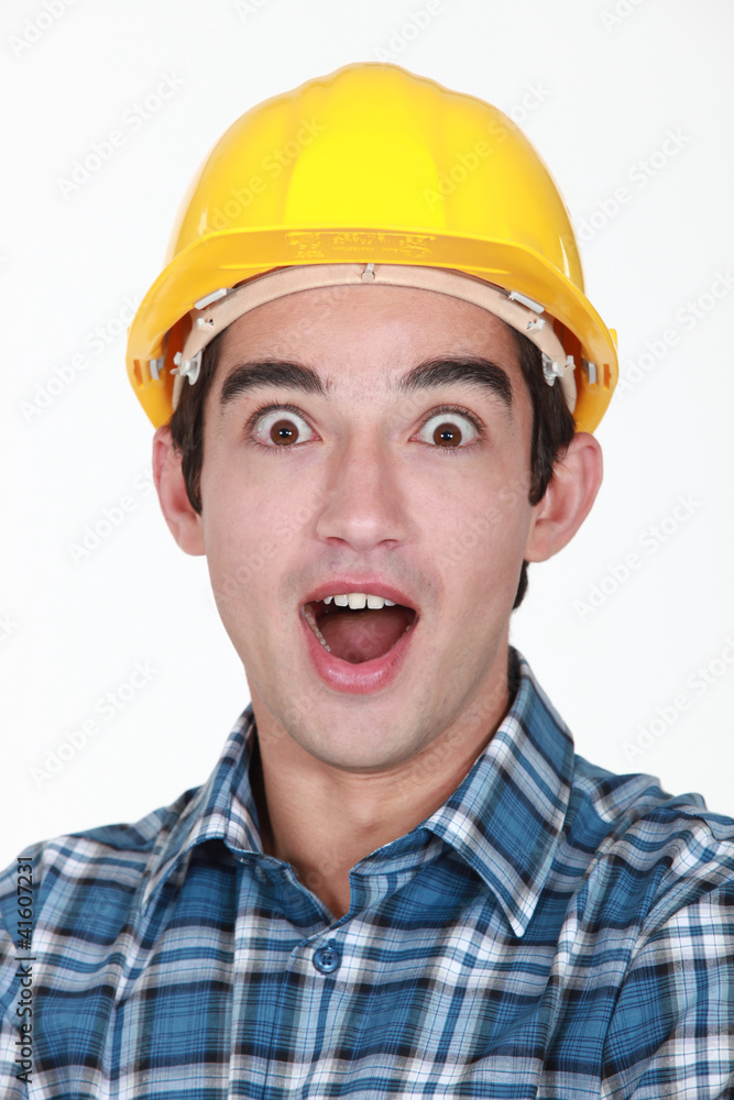 portrait of junior tradesman open-mouthed in surprise portrait of junior tradesman open-mouthed in surprise