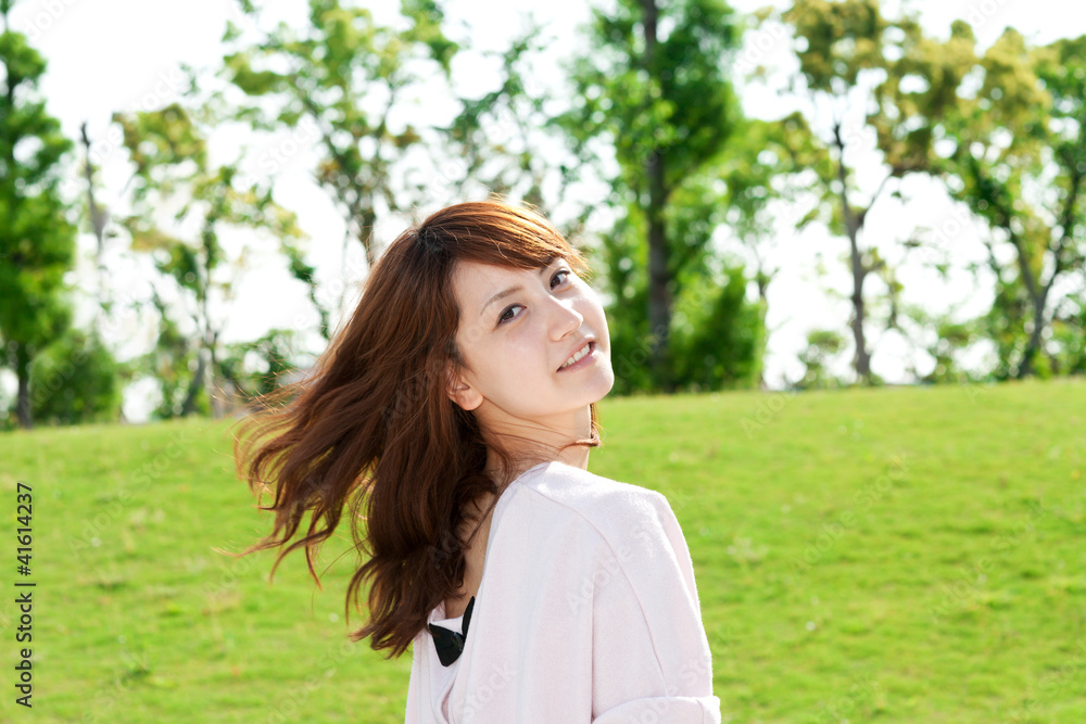 Beautiful young woman on the green. Portrait of asian woman. Beautiful young woman on the green. Portrait of asian woman.