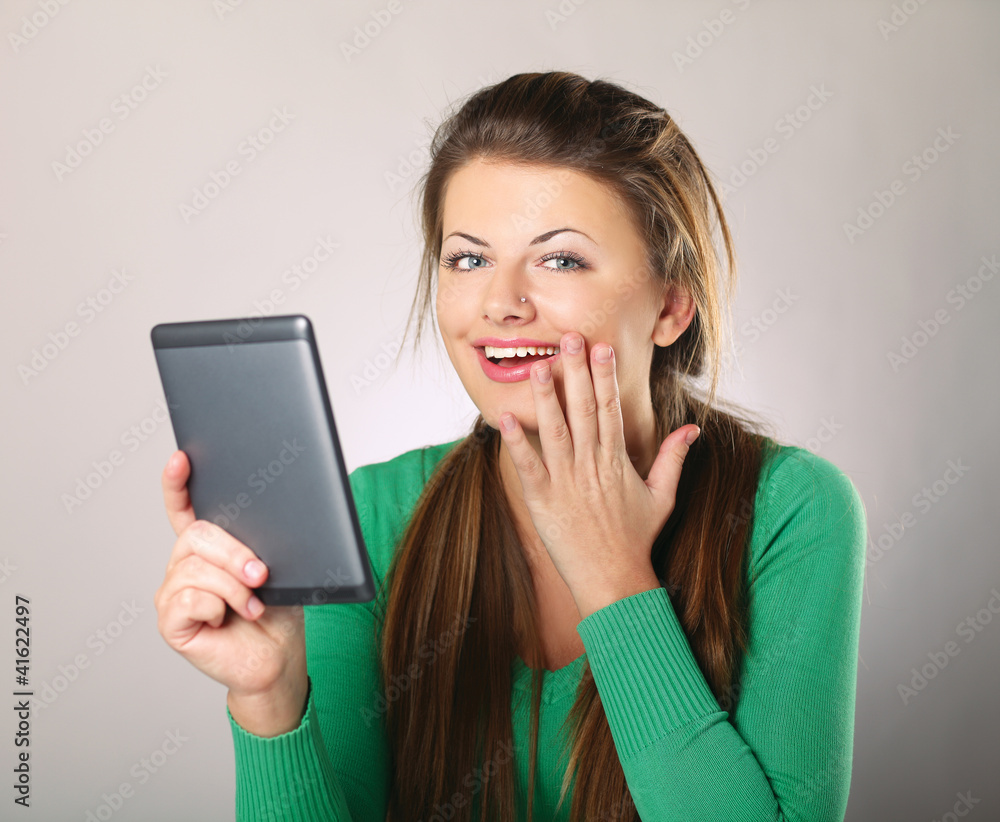 Young woman sitting and holding computer plane-table Young woman sitting and holding computer plane-table