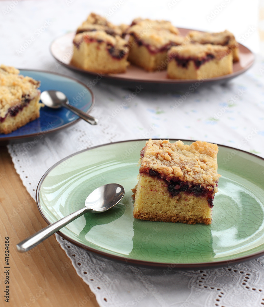 Slices of cake with jam arranged on a plate Slices of cake with jam arranged on a plate