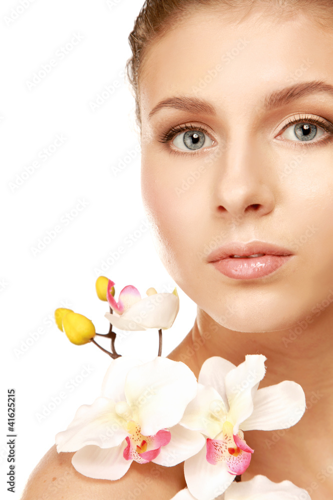 A young woman with orchid, isolated on white