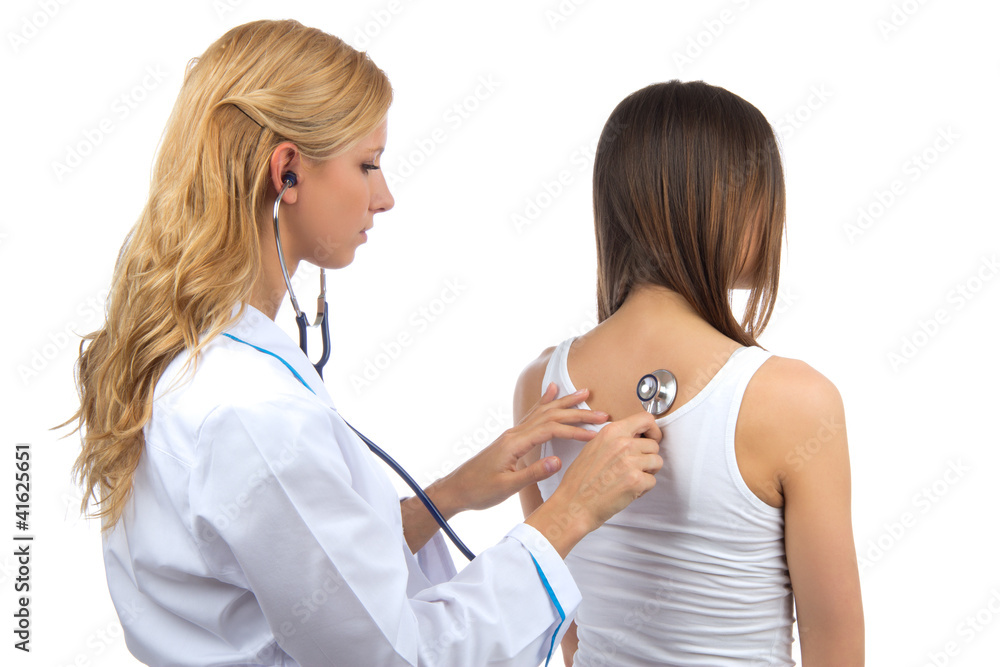 Doctor woman auscultating young patient by stethoscope Doctor woman auscultating young patient by stethoscope