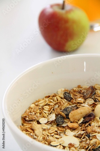 Muesli in White Bowl with Apple