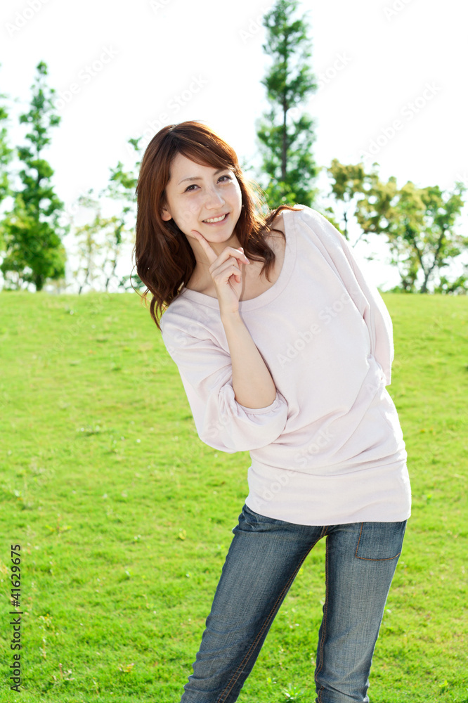 Beautiful young woman on the green. Portrait of asian woman. Beautiful young woman on the green. Portrait of asian woman.