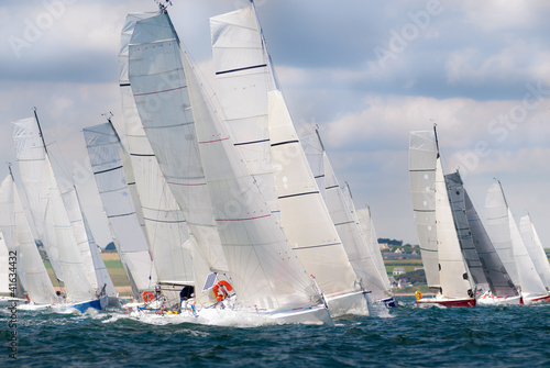 Fototapeta group of yacht sailing at regatta