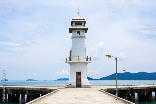 White lighthouse on jetty