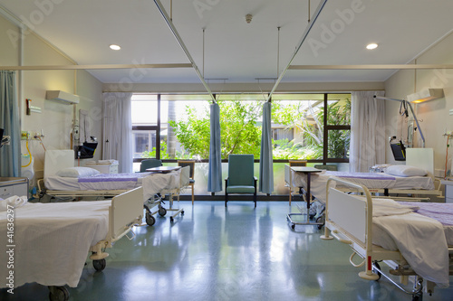 Hospital ward with beds and medical equipment in modern private hospital for COVID-19 Pandemic photo