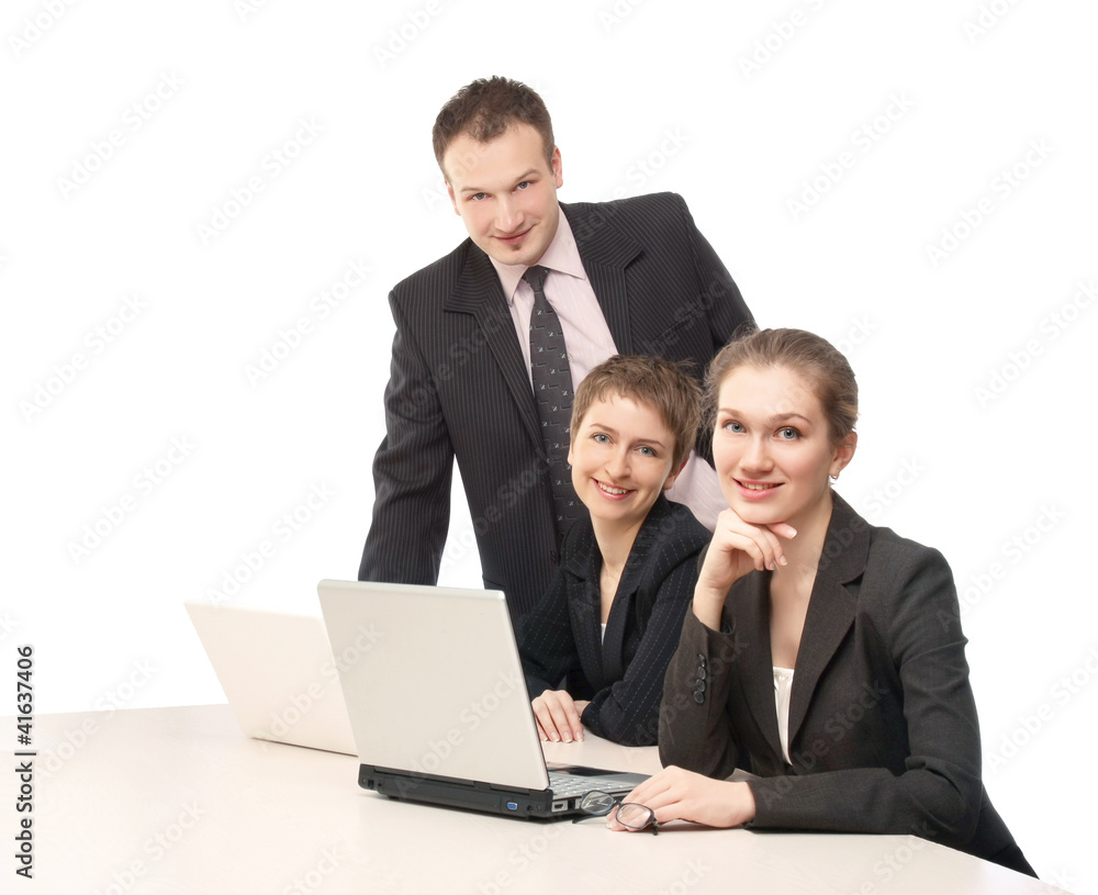 Closeup of businesspeople sitting on the table with laptop Closeup of businesspeople sitting on the table with laptop