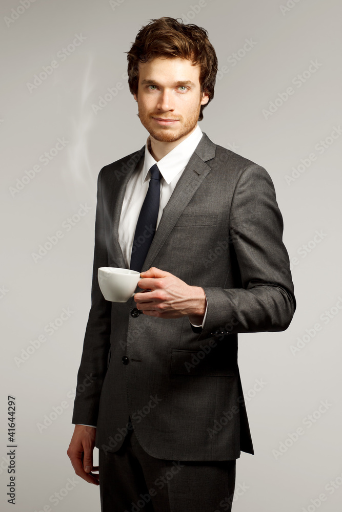 Young Business Man Holding a Cup Young Business Man Holding a Cup