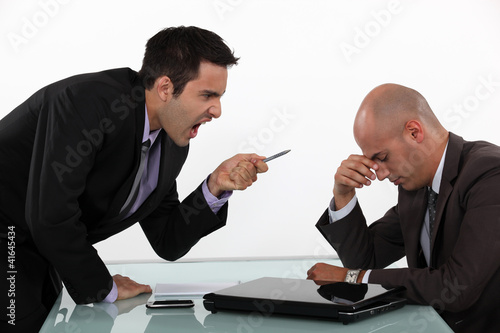 Foto Businessman screaming at a colleague