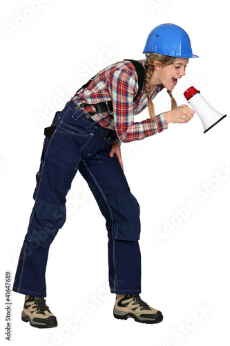 Female construction worker with a megaphone © auremar