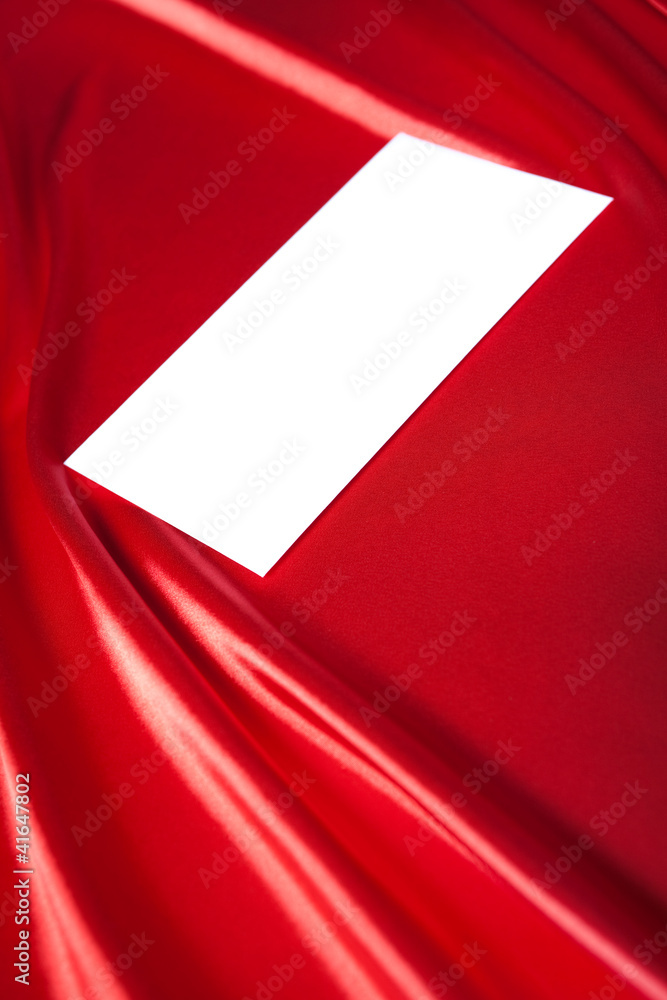 Envelope over red silk background