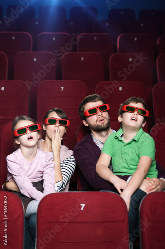 Surprised family in 3D movie theatre