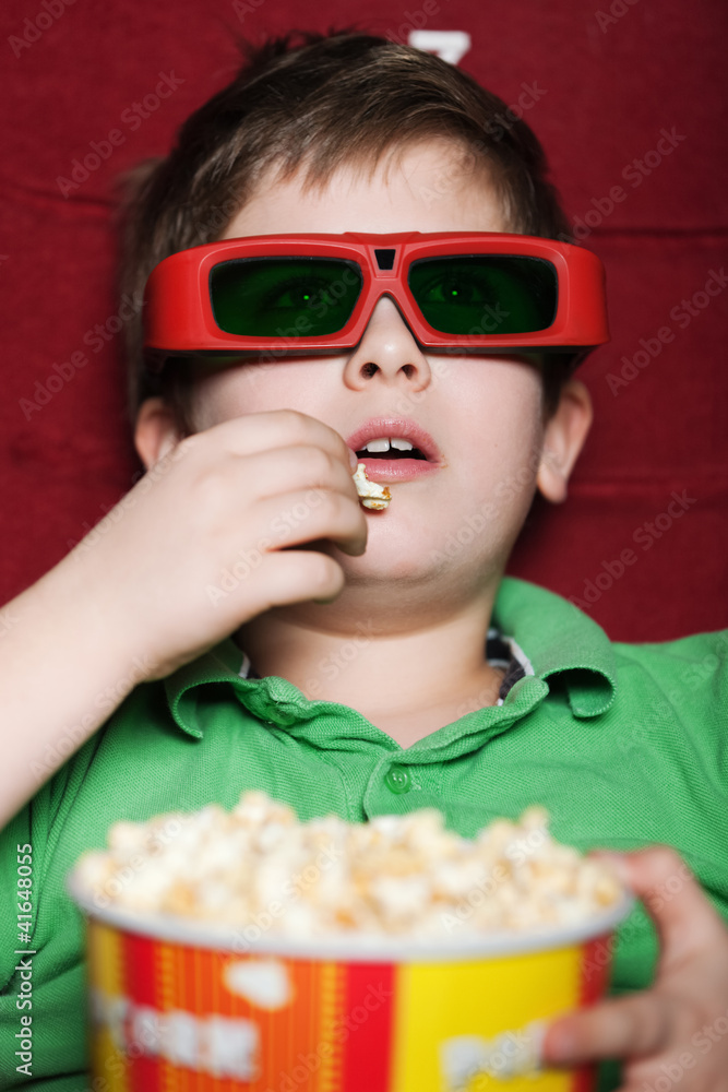 Toddler boy in 3D movie theater
