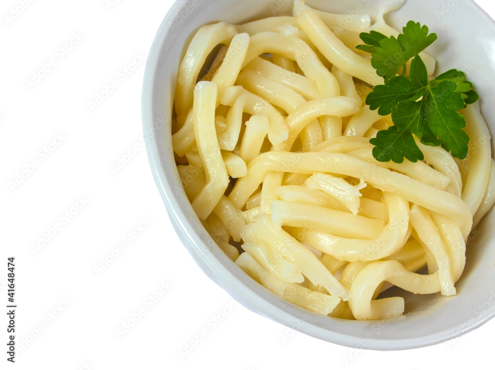 cooked pasta and parsley in a bowl isolated on white background