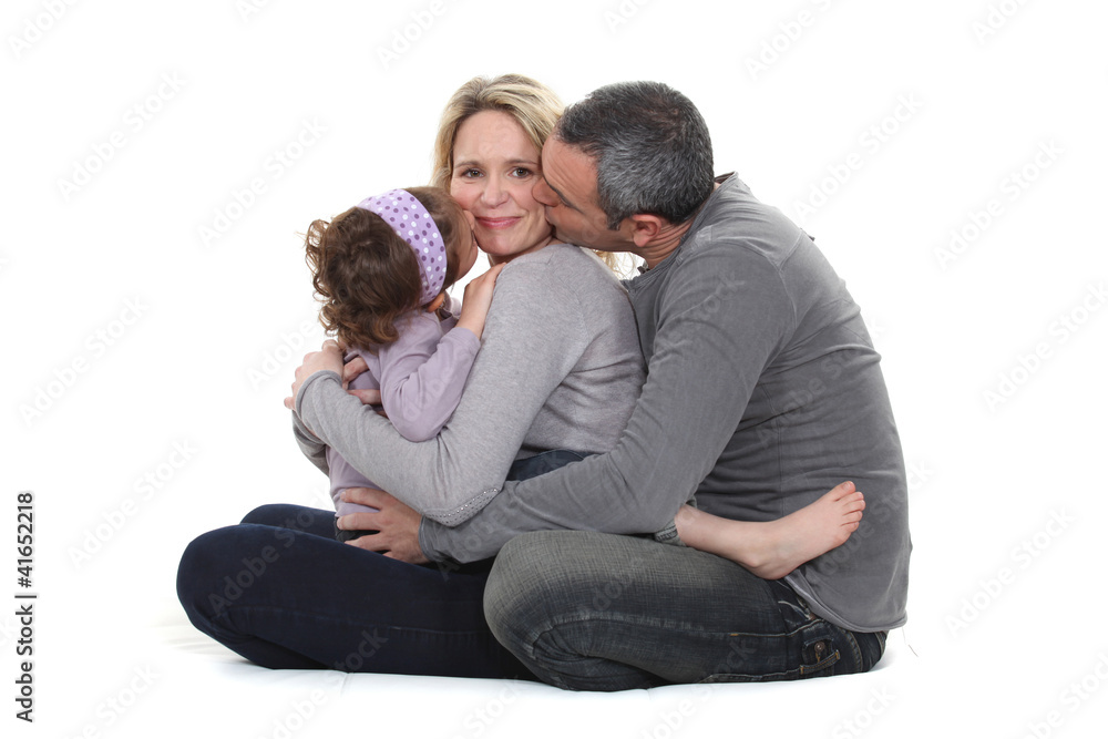 woman posing with loving husband and daughter woman posing with loving husband and daughter
