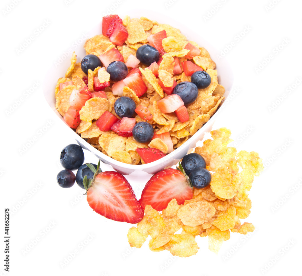 Cornflakes with fresh fruits on white Cornflakes with fresh fruits on white