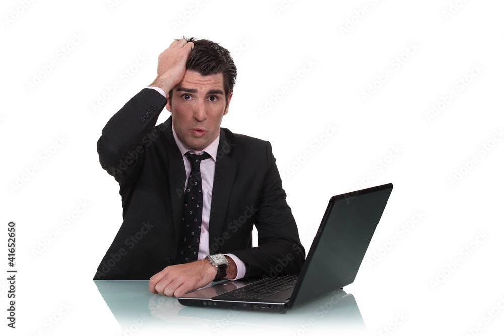 Worried businessman with a laptop Worried businessman with a laptop