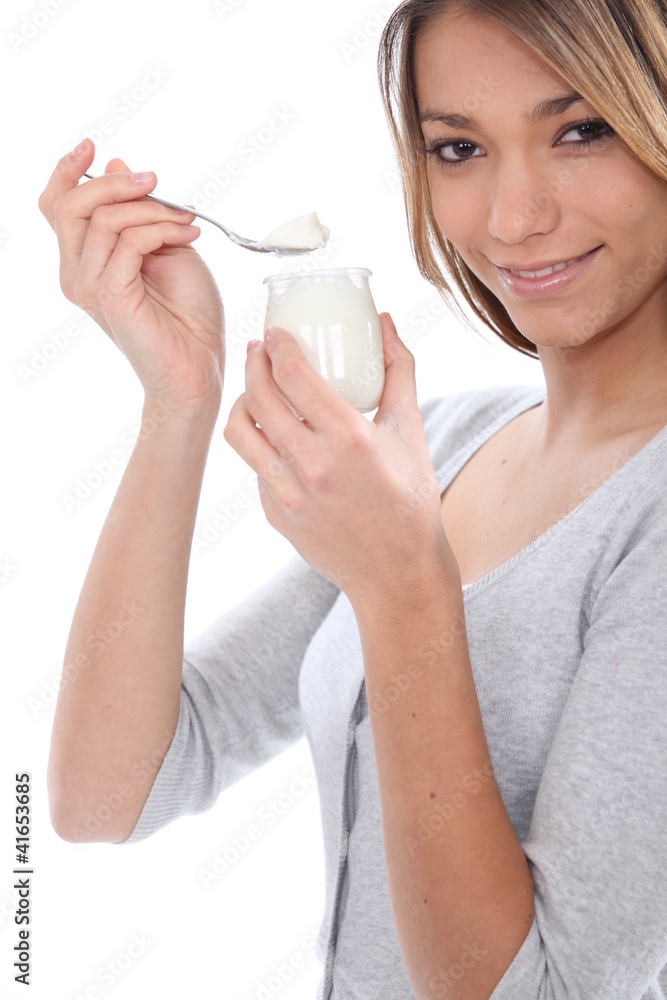 Woman eating yoghurt Woman eating yoghurt