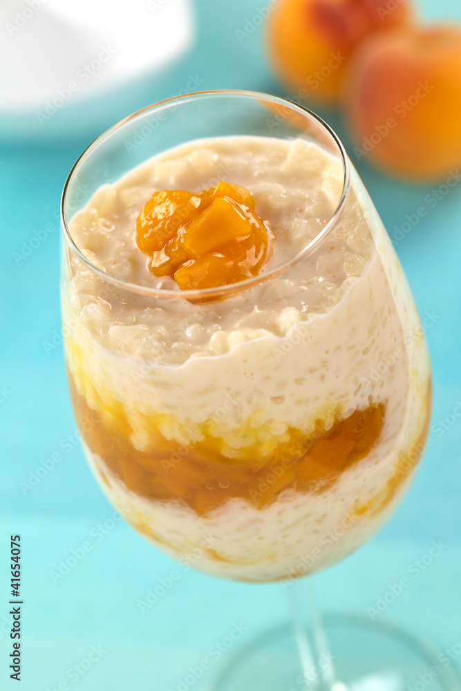 Fresh homemade rice pudding with peach compote Fresh homemade rice pudding with peach compote