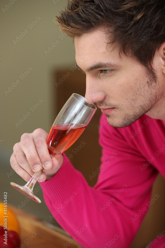 Man smelling wine