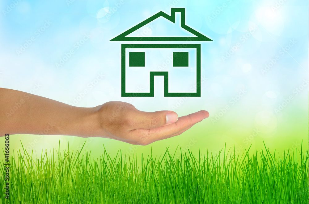 Eco concept hand and home green grass, green grass background Eco concept hand and home green grass, green grass background