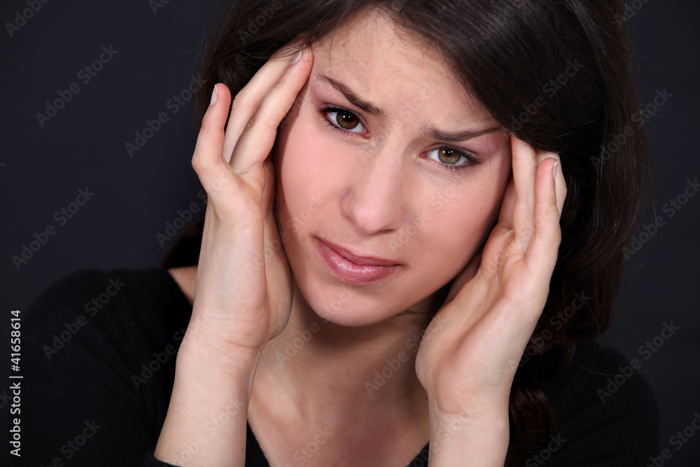 woman having a headache woman having a headache