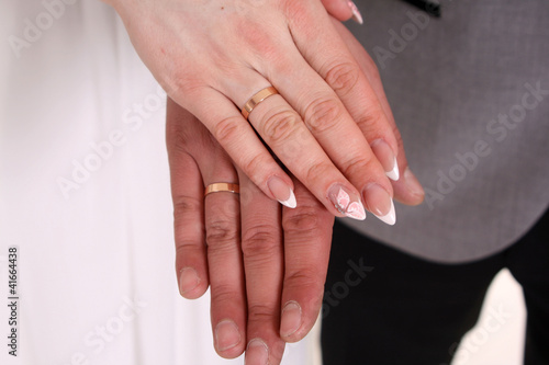 Hands of a newly-married couple