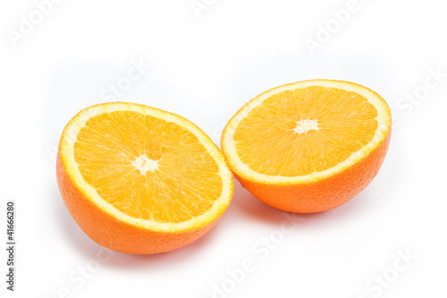 Two halves of one orange on a white background.