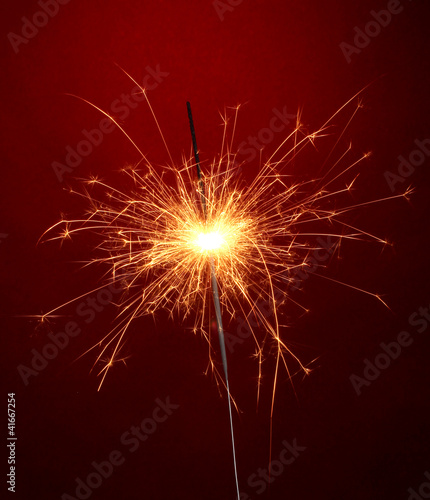 beautiful sparkler on red background