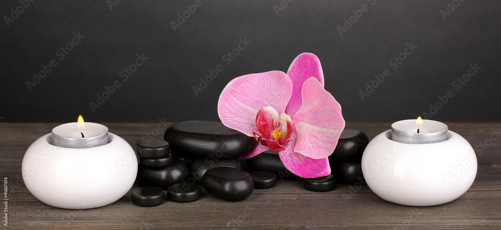 Spa stones with orchid flower and candles Spa stones with orchid flower and candles