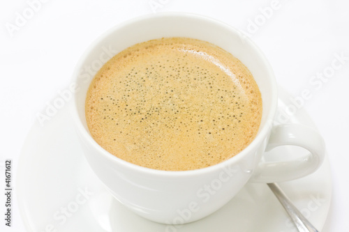 Cup of coffee with a golden beige colour