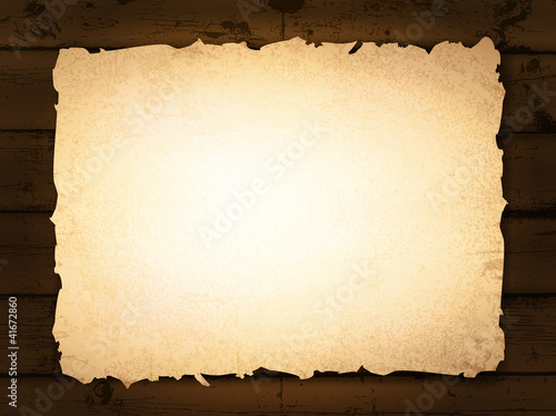 burnt paper at wooden background