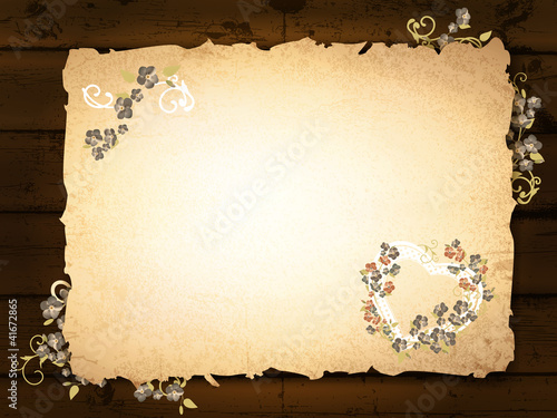 burnt paper at wooden background