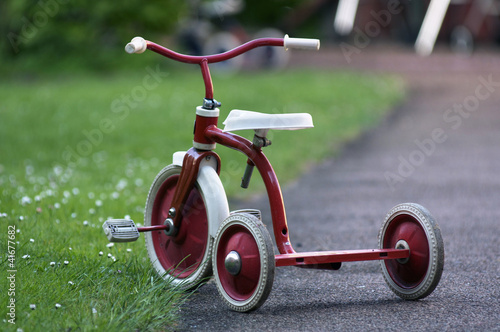 red child bicycle in a garden